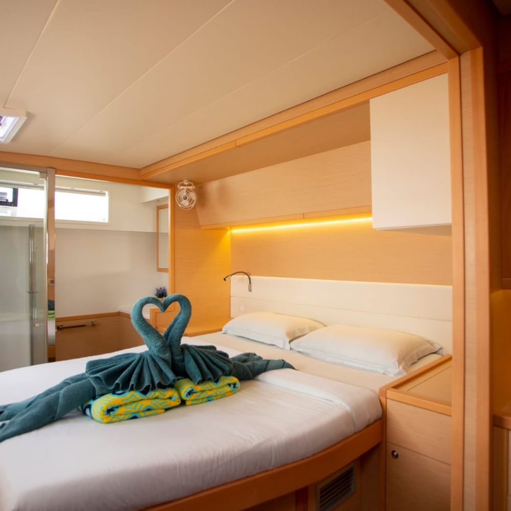 Below deck yacht bedroom with a with a king size bed